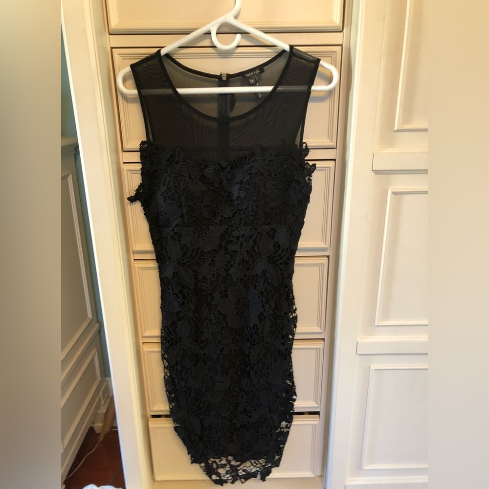 Little black sleeveless dress with lace overlay